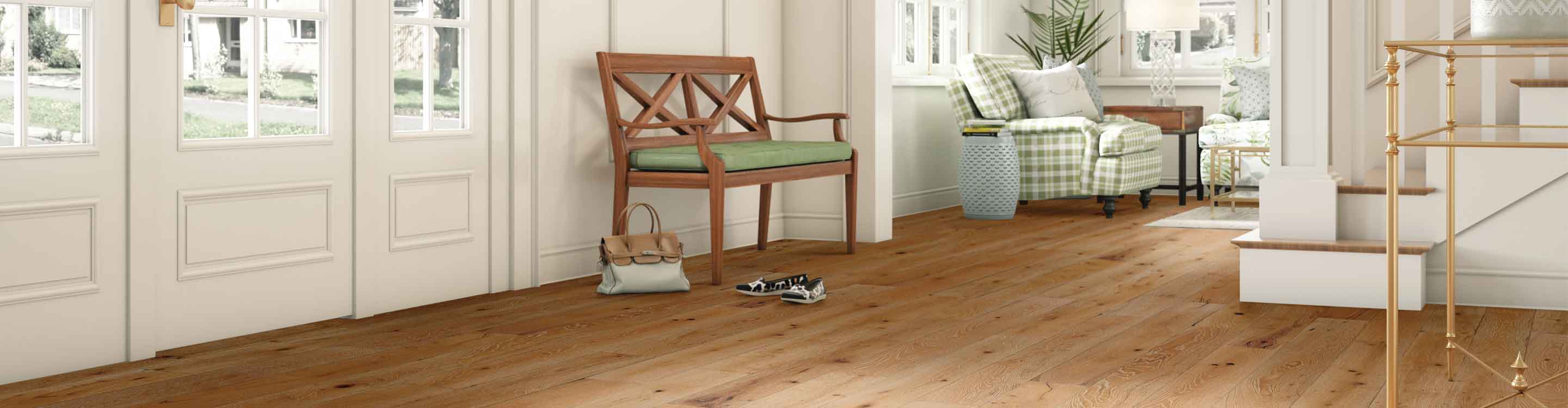 light hardwood floor in contemporary entryway with wood bench, green accents and gold entry table