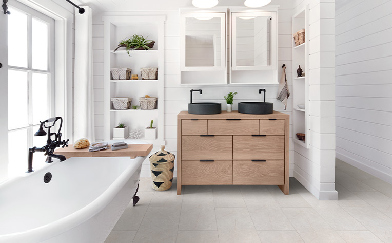 white bathroom with black sink and lvp floors